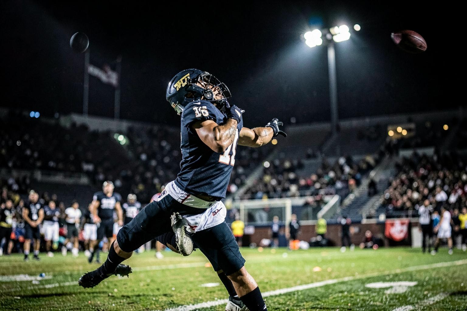Youth football running back breaking through the line